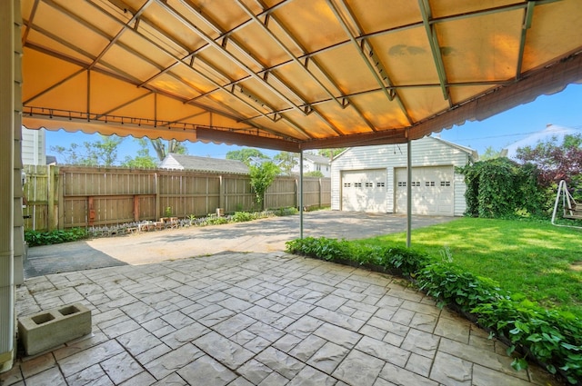 443 Binns Blvd, Columbus, OH 43204 - view of patio featuring an outbuilding and a garage