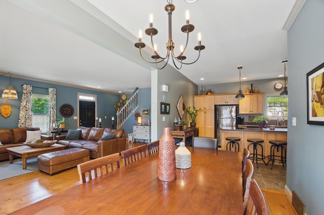 791 York St W, Mansfield, OH 44904 - dining space featuring stairs, healthy amount of natural light, a chandelier, recessed lighting, and crown molding
