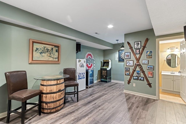 345 Quarter Way, Delaware, OH 43015 - sitting room with light wood finished floors, baseboards, and recessed lighting