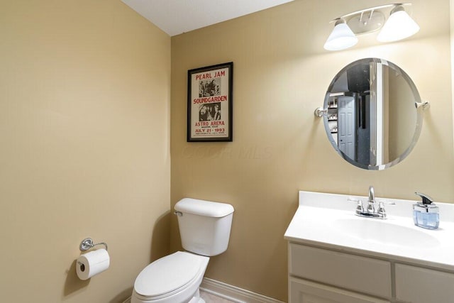 345 Quarter Way, Delaware, OH 43015 - bathroom featuring toilet, vanity, and baseboards