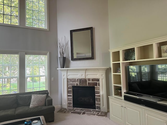 345 Quarter Way, Delaware, OH 43015 - carpeted living room featuring plenty of natural light and a fireplace