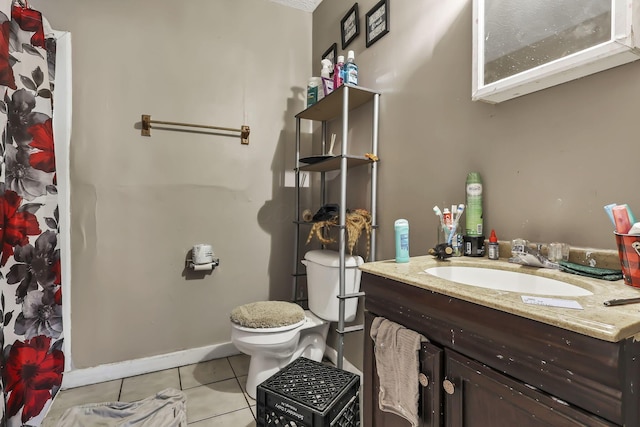 2872 Howey Rd, Columbus, OH 43224 - bathroom featuring tile patterned floors, toilet, vanity, and baseboards