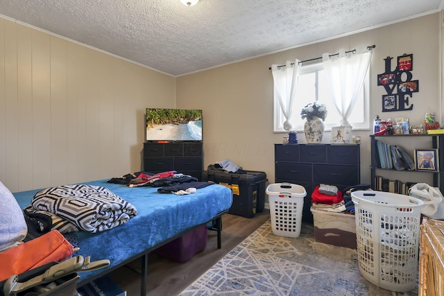 2872 Howey Rd, Columbus, OH 43224 - bedroom featuring crown molding, wood finished floors, and a textured ceiling