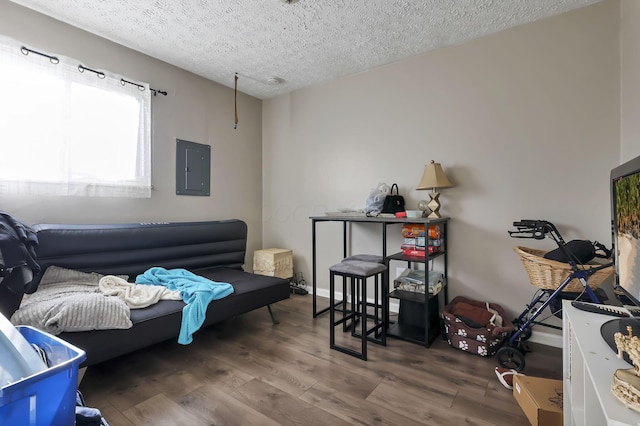 2872 Howey Rd, Columbus, OH 43224 - living area featuring electric panel, wood finished floors, and a textured ceiling