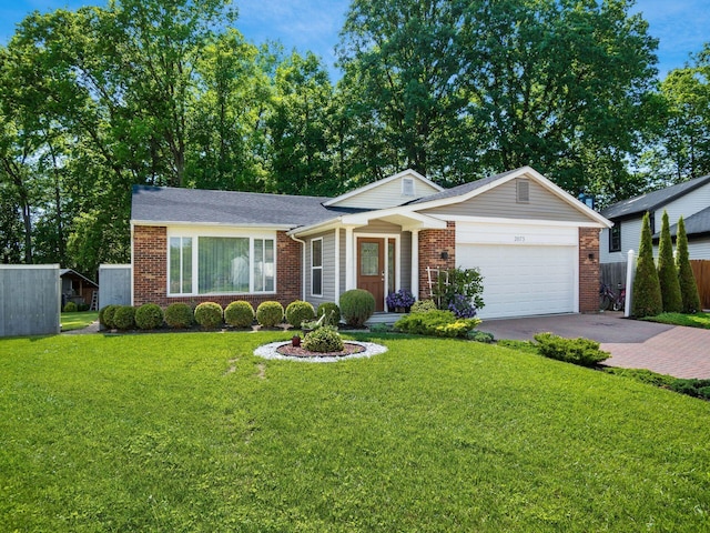 2073 Jeffey Dr, Hilliard, OH 43026 - view of front of house with brick siding, an attached garage, and driveway