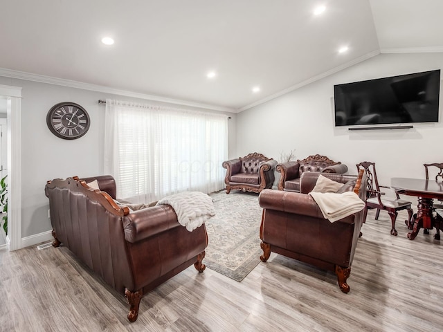 2073 Jeffey Dr, Hilliard, OH 43026 - living room with wood finished floors, crown molding, lofted ceiling, recessed lighting, and baseboards