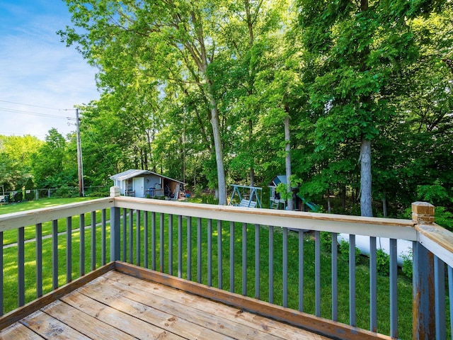2073 Jeffey Dr, Hilliard, OH 43026 - wooden terrace with a yard, a playground, an outbuilding, and view of wooded area