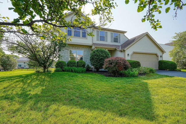 1300 Sotherby Xing, Lewis Center, OH 43035 - view of front of house with a front lawn, asphalt driveway, a garage, and stone siding