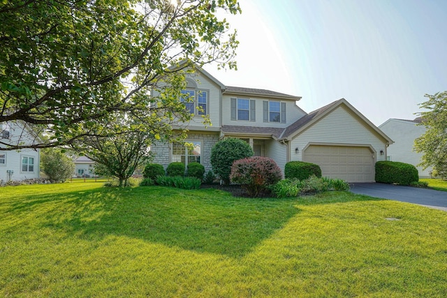 1300 Sotherby Xing, Lewis Center, OH 43035 - view of front of house featuring driveway, a front yard, and an attached garage
