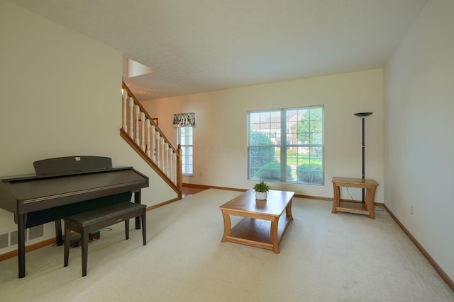 1300 Sotherby Xing, Lewis Center, OH 43035 - living room featuring stairs, carpet, and baseboards