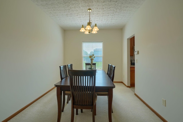 1300 Sotherby Xing, Lewis Center, OH 43035 - dining area with a chandelier, light colored carpet, baseboards, and a textured ceiling
