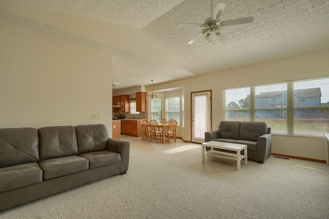 1300 Sotherby Xing, Lewis Center, OH 43035 - living area with a textured ceiling, baseboards, ceiling fan, lofted ceiling, and light carpet