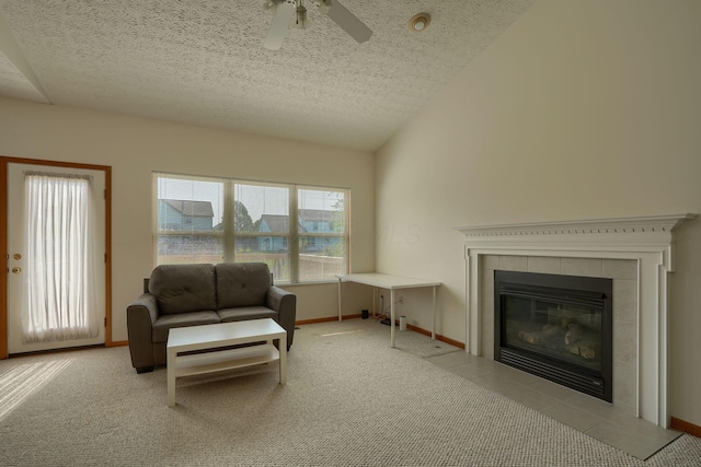 1300 Sotherby Xing, Lewis Center, OH 43035 - living area featuring ceiling fan, a textured ceiling, a tile fireplace, and baseboards