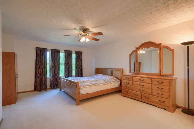 1300 Sotherby Xing, Lewis Center, OH 43035 - bedroom with light carpet, a ceiling fan, baseboards, and a textured ceiling