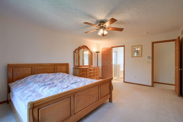 1300 Sotherby Xing, Lewis Center, OH 43035 - bedroom with light carpet, baseboards, a textured ceiling, a ceiling fan, and ensuite bath