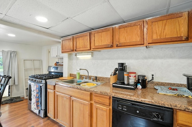 1106 E Walnut St, Lancaster, OH 43130 - kitchen with stainless steel gas range oven, dishwasher, light wood-style flooring, a paneled ceiling, and brown cabinetry