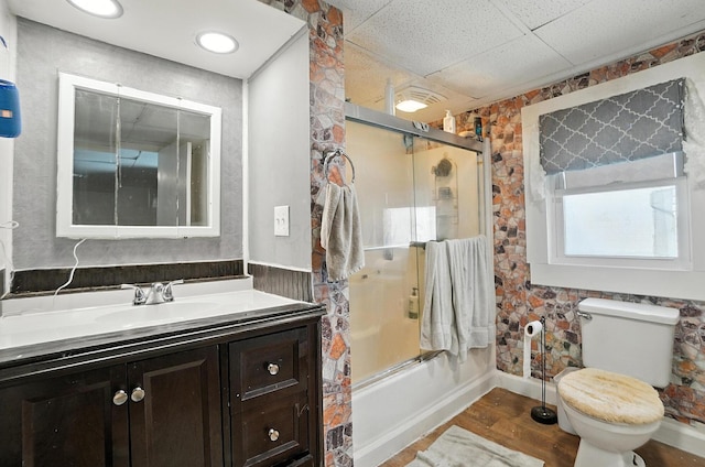 1106 E Walnut St, Lancaster, OH 43130 - full bath featuring combined bath / shower with glass door, vanity, wood finished floors, and a drop ceiling