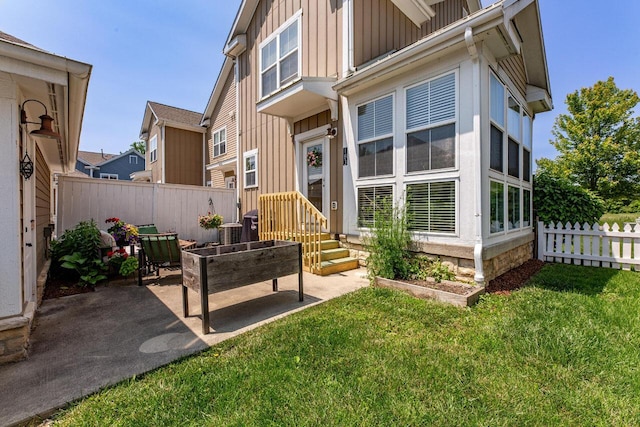 183 W Case St, Powell, OH 43065 - rear view of house featuring board and batten siding and a patio area