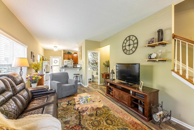 183 W Case St, Powell, OH 43065 - living room with wood finished floors, baseboards, and stairway