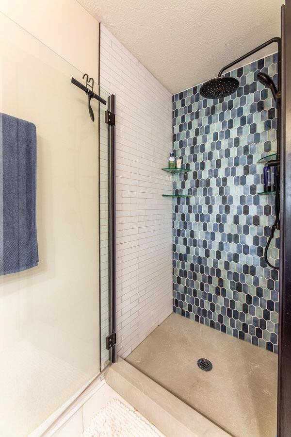 183 W Case St, Powell, OH 43065 - full bath with a stall shower and a textured ceiling