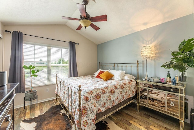 183 W Case St, Powell, OH 43065 - bedroom with vaulted ceiling, wood finished floors, a ceiling fan, a textured ceiling, and baseboards