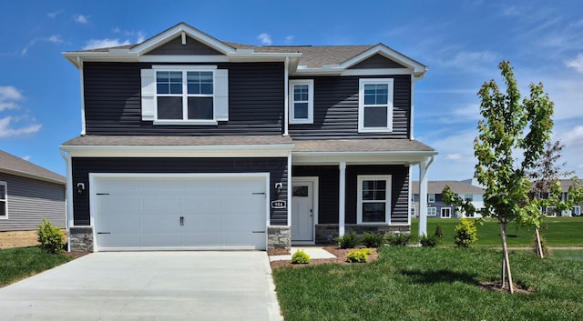 904 Allegro Dr, Reynoldsburg, OH 43068 - craftsman-style house featuring a garage, driveway, a front lawn, stone siding, and roof with shingles