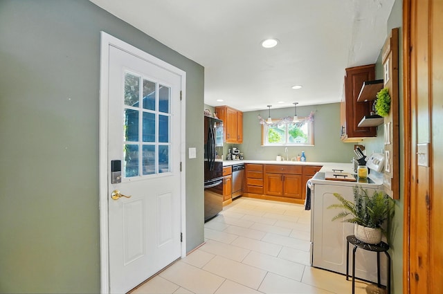 4 Greer St, Mount Vernon, OH 43050 - kitchen featuring freestanding refrigerator, stainless steel dishwasher, stove, light tile patterned floors, and range hood
