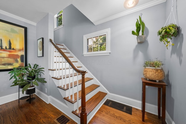 472 Tibet Rd, Columbus, OH 43202 - stairs with crown molding, wood finished floors, and baseboards