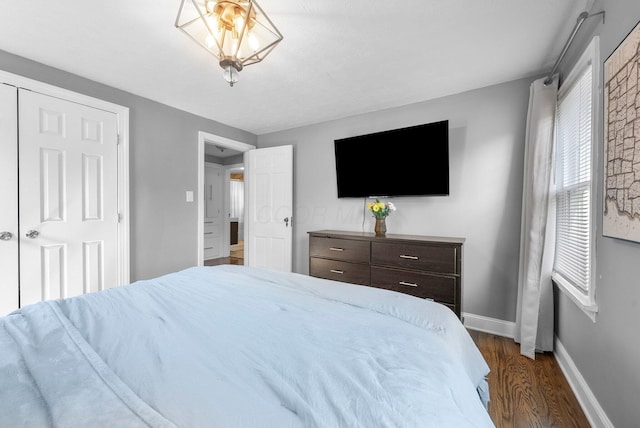 472 Tibet Rd, Columbus, OH 43202 - bedroom with dark wood-style flooring and baseboards