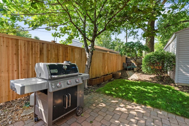 472 Tibet Rd, Columbus, OH 43202 - fenced backyard featuring area for grilling and a patio