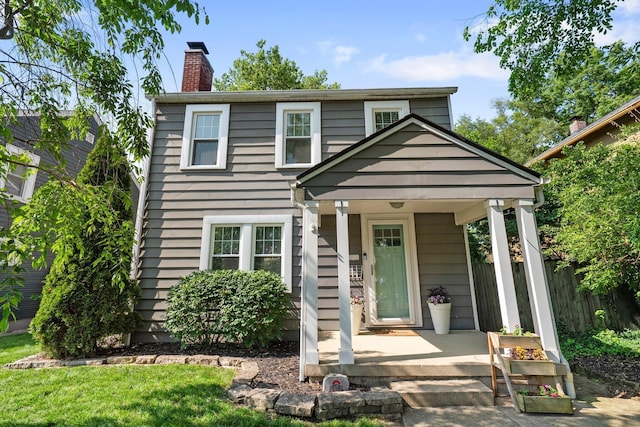 472 Tibet Rd, Columbus, OH 43202 - view of front of home featuring a porch and a chimney