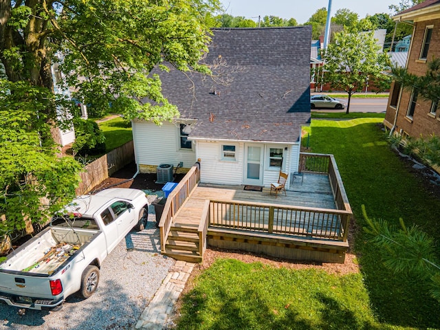 77 W High St, Mount Gilead, OH 43338 - back of property with a shingled roof, central AC, and a deck
