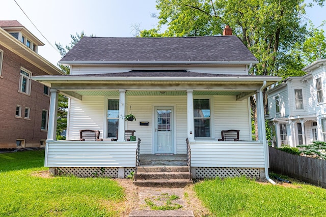 77 W High St, Mount Gilead, OH 43338 - bungalow featuring a porch, a chimney, and roof with shingles