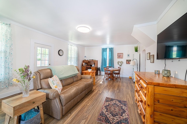 77 W High St, Mount Gilead, OH 43338 - living area featuring wood finished floors, crown molding, and arched walkways