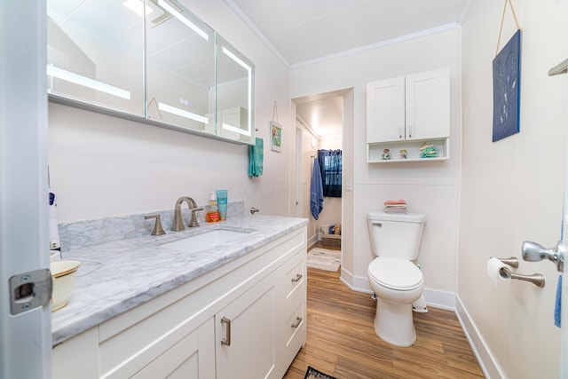 77 W High St, Mount Gilead, OH 43338 - bathroom featuring ornamental molding, toilet, vanity, wood finished floors, and baseboards