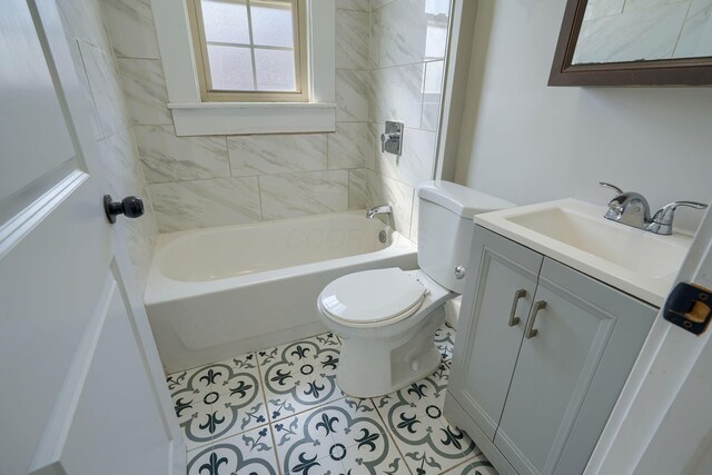 909-915 Wilson Ave, Columbus, OH 43206 - bathroom featuring toilet, vanity, tile patterned floors, and shower / washtub combination