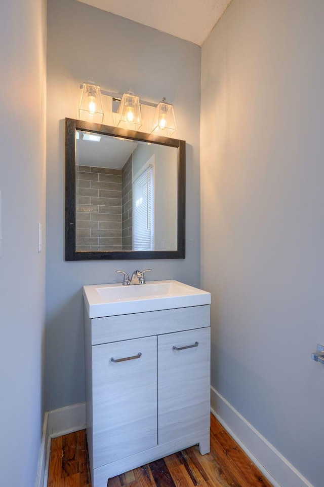 909-915 Wilson Ave, Columbus, OH 43206 - bathroom with baseboards, vanity, and wood finished floors