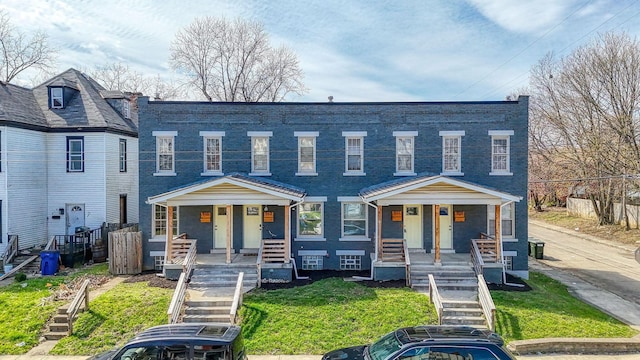 909-915 Wilson Ave, Columbus, OH 43206 - view of property with covered porch, stairway, and a front lawn