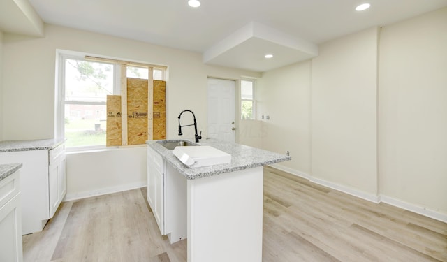 1292-1298 E 17th Ave, Columbus, OH 43211 - kitchen featuring a sink, a kitchen island with sink, plenty of natural light, light wood-type flooring, and recessed lighting