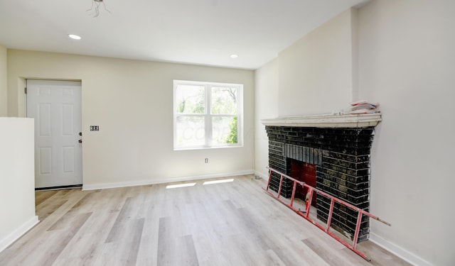 1292-1298 E 17th Ave, Columbus, OH 43211 - unfurnished living room featuring light wood finished floors, baseboards, a brick fireplace, and recessed lighting