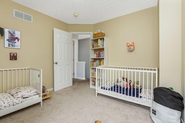 302 Streamwater Ct, Blacklick, OH 43004 - carpeted bedroom with a nursery area and a textured ceiling