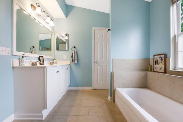 302 Streamwater Ct, Blacklick, OH 43004 - bathroom with vanity, a bath, healthy amount of natural light, tile patterned floors, and vaulted ceiling