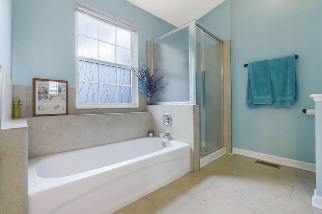 302 Streamwater Ct, Blacklick, OH 43004 - bathroom featuring a garden tub, a shower stall, and tile patterned flooring