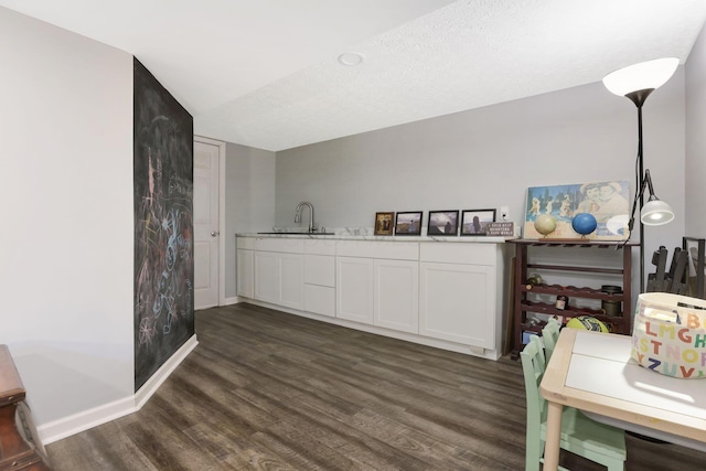 302 Streamwater Ct, Blacklick, OH 43004 - kitchen with dark wood-type flooring, baseboards, white cabinets, a sink, and light countertops