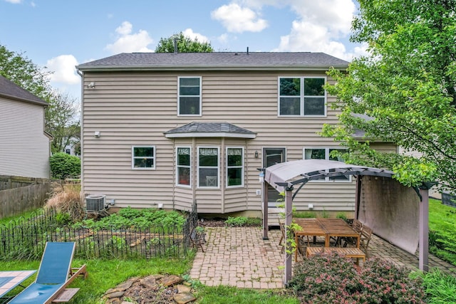 302 Streamwater Ct, Blacklick, OH 43004 - back of house with a patio, central AC unit, and roof with shingles