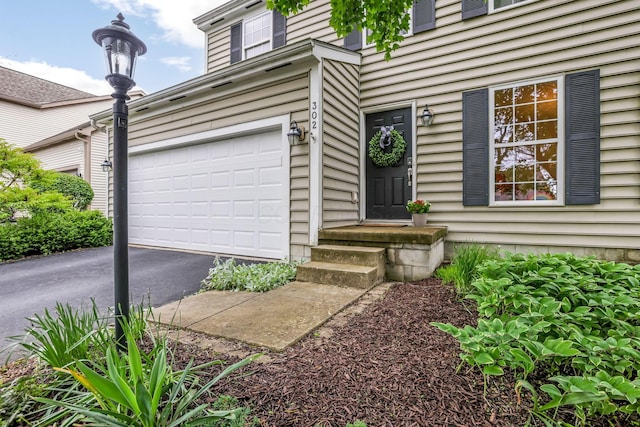 302 Streamwater Ct, Blacklick, OH 43004 - doorway to property featuring a garage and driveway