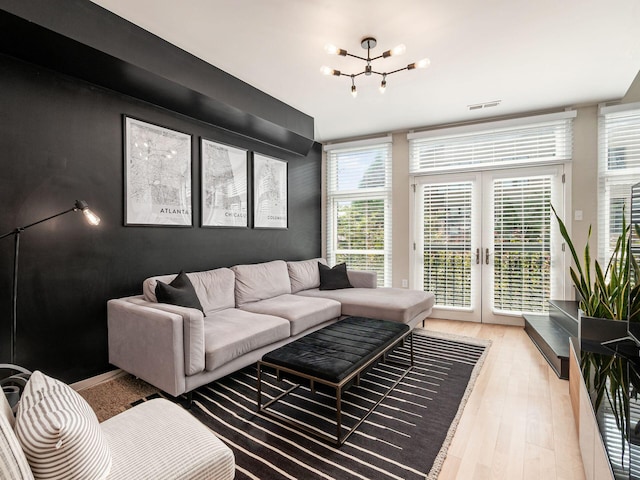 802 N 4th St Unit 802, Columbus, OH 43215 - living area featuring a chandelier, wood finished floors, and french doors