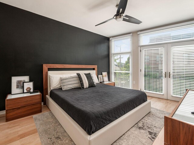 802 N 4th St Unit 802, Columbus, OH 43215 - bedroom featuring an accent wall, access to outside, light wood-style floors, and ceiling fan