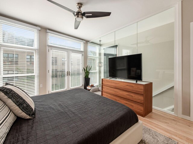 802 N 4th St Unit 802, Columbus, OH 43215 - bedroom featuring wood finished floors, access to exterior, a ceiling fan, and baseboards