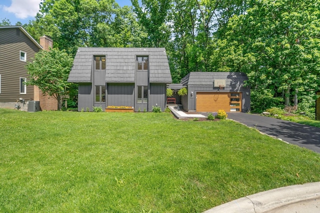 8121 Blind Brook Ct, Columbus, OH 43235 - view of front property with mansard roof, an outdoor structure, a front yard, and driveway